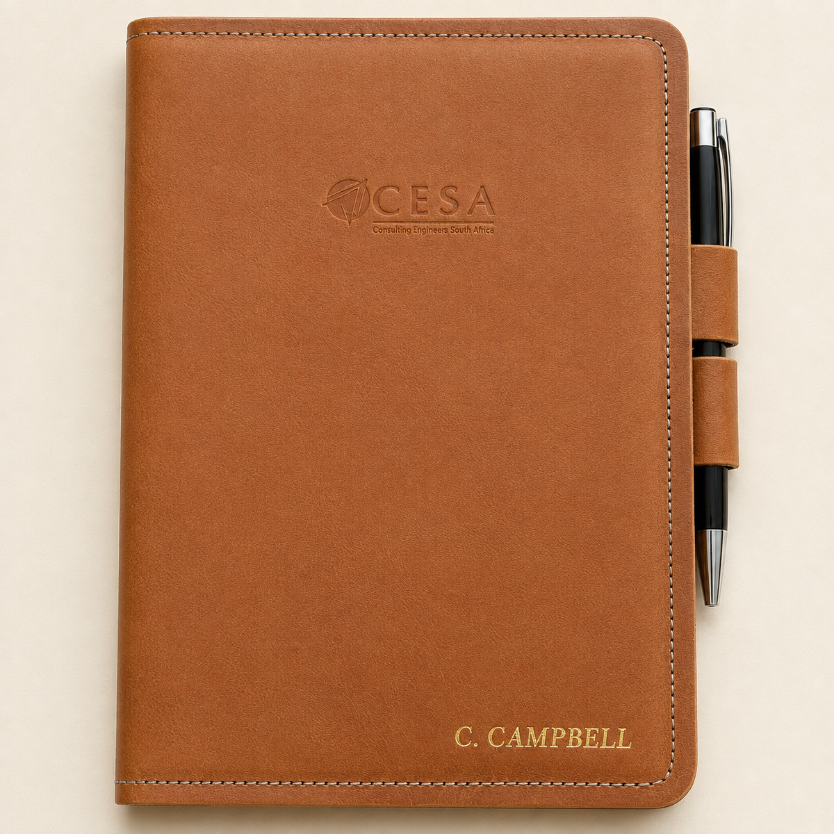 Personalised tan A5 leather notebook cover with pen-lock closure